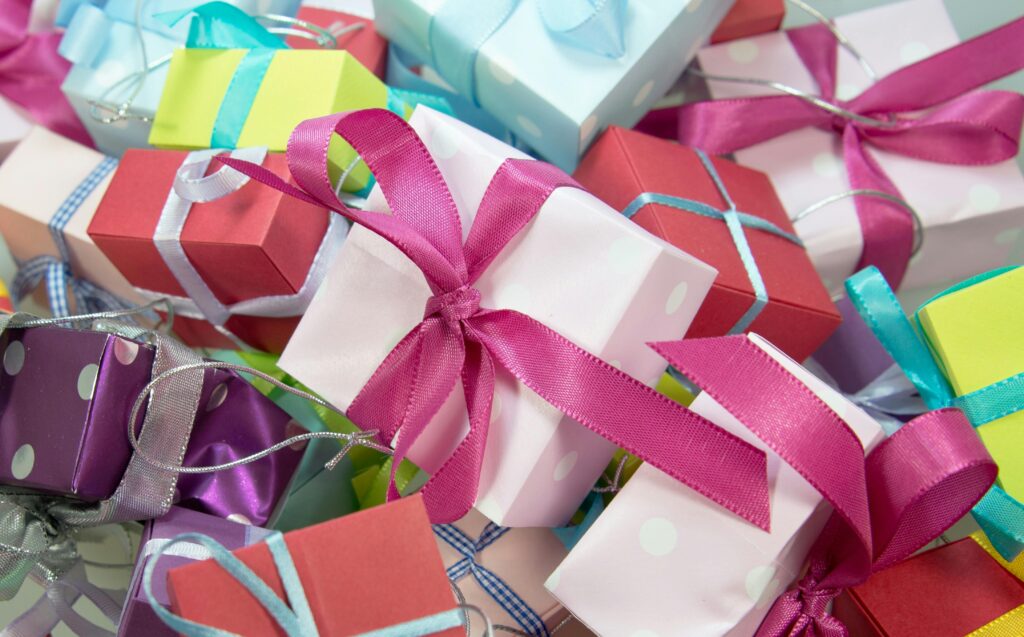 A vibrant collection of gift boxes with colorful ribbons, ideal for celebrations.